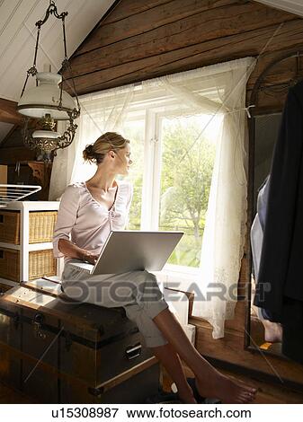 Stock Photo - Businesswoman working from home office. Fotosearch