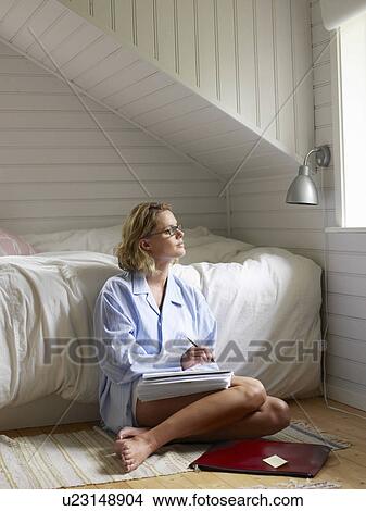 Picture - Businesswoman working from home. Fotosearch