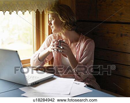 Businesswoman working from home View Large Photo Image Stock Image - Businesswoman working from home. Fotosearch