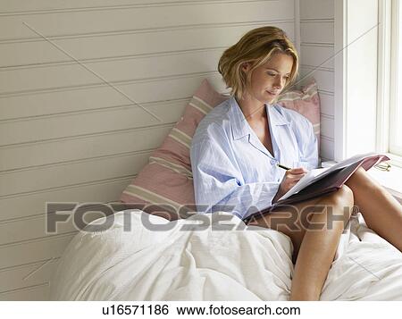 Businesswoman working from home View Large Photo Image Stock Photograph - Businesswoman working from home. Fotosearch