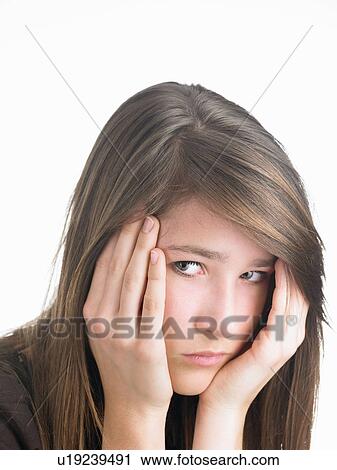 Stock Image - Girl looking at camera, seriously. Fotosearch