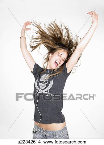 Picture - Woman dancing and listening to music. Fotosearch