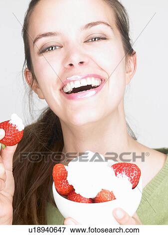 Woman eating strawberries View Large Photo Image Stock Photo - Woman eating strawberries. Fotosearch