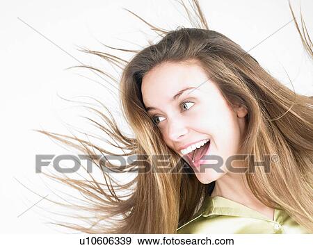 Woman smiling, on the move View Large Photo Image Stock Photo - Woman smiling, on the move. Fotosearch