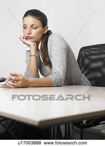 Businesswoman at her desk View Large Photo Image Stock Photo - Businesswoman at her desk. Fotosearch