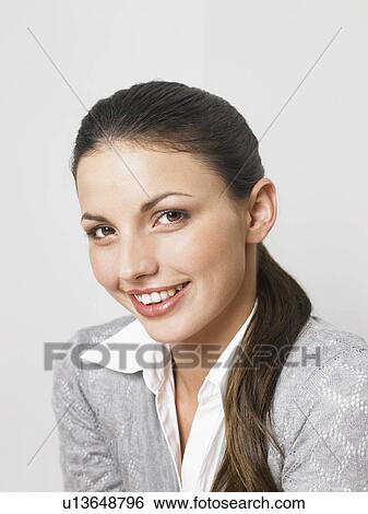 Businesswoman at her desk View Large Photo Image Stock Photograph - Businesswoman at her desk. Fotosearch