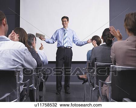 Man giving speech in presentation room View Large Photo Image Stock Image - Man giving speech in presentation room. Fotosearch