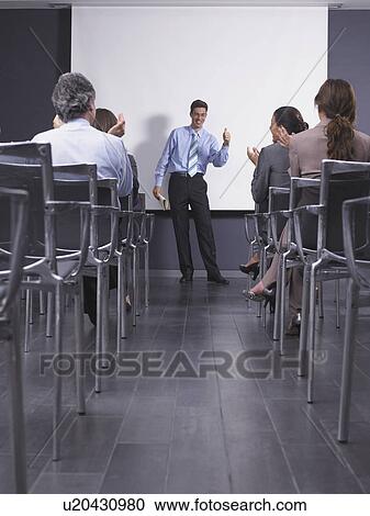 Man giving speech in presentation room View Large Photo Image Stock Image - Man giving speech in presentation room. Fotosearch