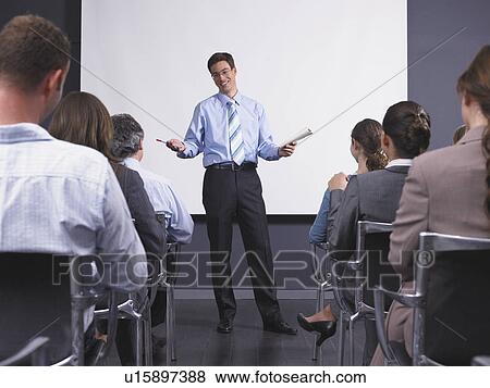 Man giving speech in presentation room View Large Photo Image Stock Photo - Man giving speech in presentation room. Fotosearch