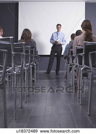 Man giving speech in presentation room View Large Photo Image Stock Photo - Man giving speech in presentation room. Fotosearch