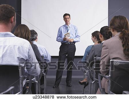 Man giving speech in presentation room View Large Photo Image Stock Photo - Man giving speech in presentation room. Fotosearch