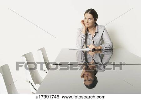 Young business woman at desk with reflections. View Large Photo Image Stock Photograph - Young business woman at desk with reflections.. Fotosearch