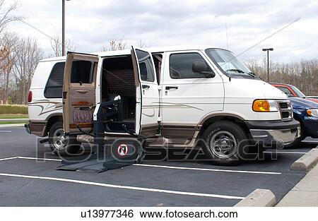 Accessible van equipped with a lift for scooters or wheelchairs. View Large Photo Image Stock Photograph - Accessible van equipped with a lift for scooters or wheelchairs.. Fotosearch