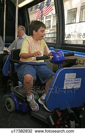 Boy with Muscular Dystrophy, utilizing a scooter/cart for mobility, using a city bus. View Large Photo Image Stock Image - Boy with Muscular Dystrophy, utilizing a scooter/cart for mobility, using a city bus.. Fotosearch