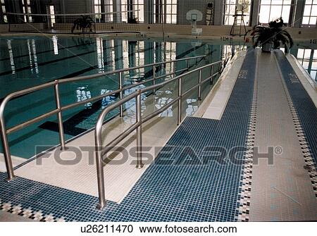 Image of a sloped ramp to access the swimming pool. This ramp, while useful for all pool patrons, is especially useful for individuals who have difficulty with stairs. View Large Photo Image Stock Image - Image of a sloped ramp to access the swimming pool. This ramp, while useful for all pool patrons, is especially useful for individuals who have difficulty with stairs.. Fotosearch