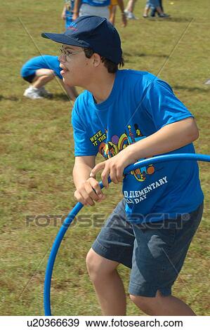 Young man with Down’s Syndrome having a great time on the playground. View Large Photo Image Stock Photo - Young man with Down’s Syndrome having a great time on the playground.. Fotosearch