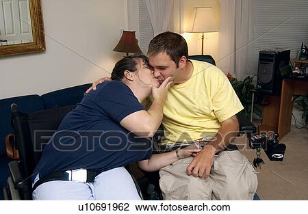 A young couple, both with disabilities, enjoying what they say they do best - kissing! View Large Photo Image Stock Image - A young couple, both with disabilities, enjoying what they say they do best - kissing!. Fotosearch