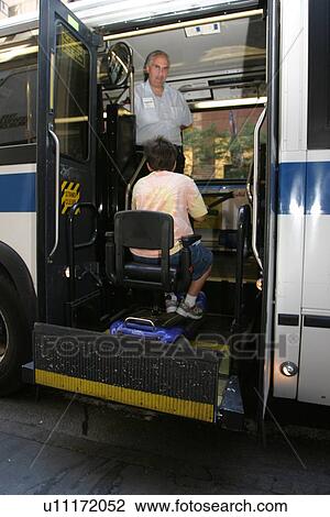 Boy with Muscular Dystrophy, utilizing a scooter/cart for mobility, getting on a city bus via a chair lift. View Large Photo Image Stock Image - Boy with Muscular Dystrophy, utilizing a scooter/cart for mobility, getting on a city bus via a chair lift.. Fotosearch