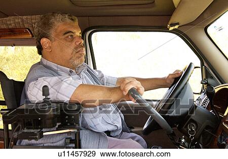 Man with a disability driving his van equipped with hand controls. View Large Photo Image Stock Photo - Man with a disability driving his van equipped with hand controls.. Fotosearch