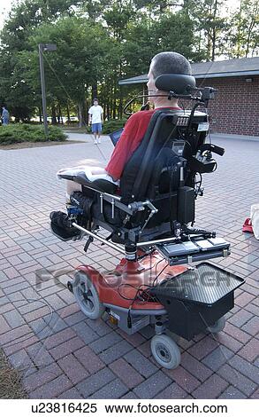 Rear image of a man with a disability utilizing a motorized wheel chair for mobility. Chair is maneuvered via mouth controls. View Large Photo Image Stock Photography - Rear image of a man with a disability utilizing a motorized wheel chair for mobility. Chair is maneuvered via mouth controls.. Fotosearch