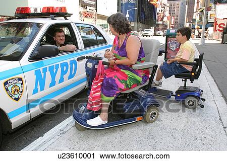 Woman and child, both with disabilities, talking with a New York City police officer. View Large Photo Image Stock Image - Woman and child, both with disabilities, talking with a New York City police officer.. Fotosearch