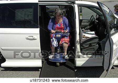 Woman exits accessible van using ramp View Large Photo Image Stock Image - Woman exits accessible van using ramp. Fotosearch