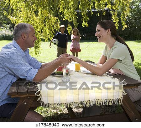 A family in the garden View Large Photo Image Stock Image - A family in the garden. Fotosearch