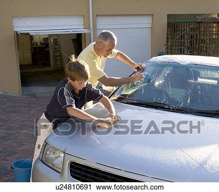 Father and son washing a car View Large Photo Image Stock Image - Father and son washing a car. Fotosearch