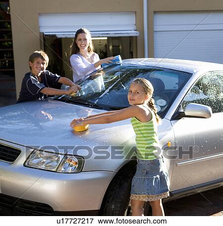 Stock Photo - Mother and her children washing a car. Fotosearch