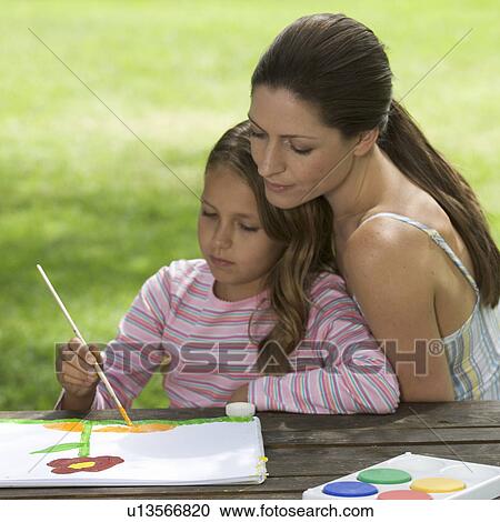 Mother and young daughter sitting in a garden painting View Large Photo Image Stock Image - Mother and young daughter sitting in a garden painting. Fotosearch