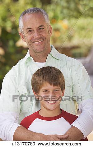 Portrait of a father with his young son View Large Photo Image Stock Image - Portrait of a father with his young son. Fotosearch