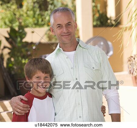 Stock Photography - Portrait of a father with his young son. Fotosearch