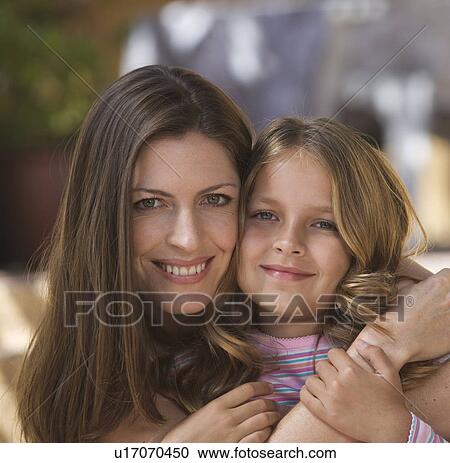 Portrait of a mother and her young daughter, close-up View Large Photo Image Stock Image - Portrait of a mother and her young daughter, close-up. Fotosearch