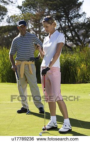 Stock Photograph - Interruption to the game of golf. Fotosearch
