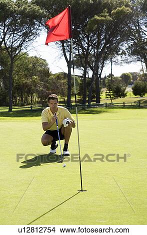 Picture - Man playing golf. Fotosearch