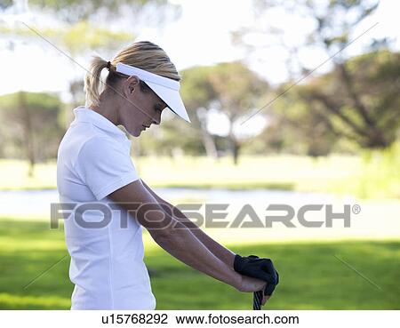 Woman playing golf View Large Photo Image Stock Image - Woman playing golf. Fotosearch