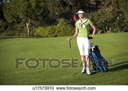 Woman playing golf View Large Photo Image Stock Image - Woman playing golf. Fotosearch