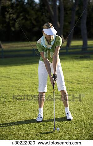 Woman playing golf View Large Photo Image Stock Image - Woman playing golf. Fotosearch