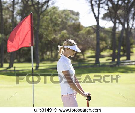 Woman playing golf View Large Photo Image Stock Photo - Woman playing golf. Fotosearch