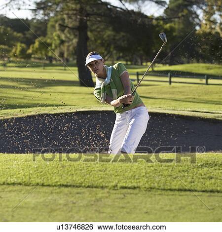 Woman playing golf View Large Photo Image Stock Photograph - Woman playing golf. Fotosearch