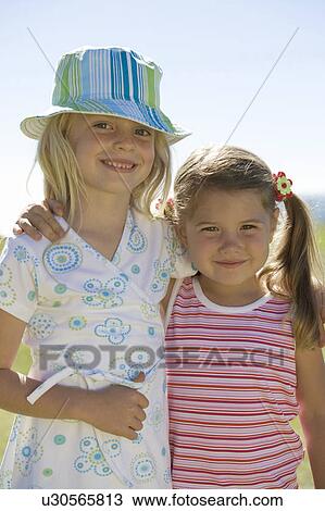 Portrait of two young girls View Large Photo Image Stock Image - Portrait of two young girls. Fotosearch