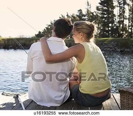 Stock Photography - A young couple fishing. Fotosearch