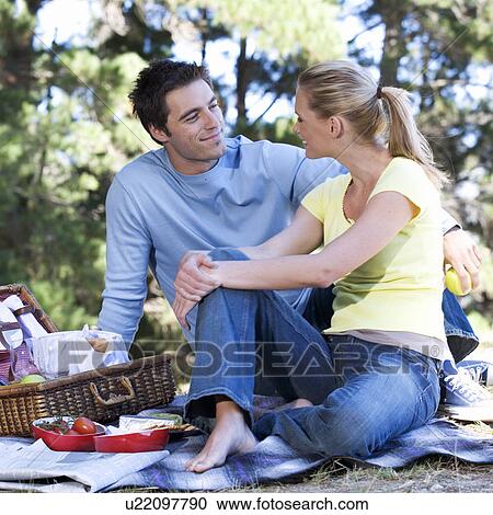 A young couple having a picnic View Large Photo Image Stock Image - A young couple having a picnic. Fotosearch