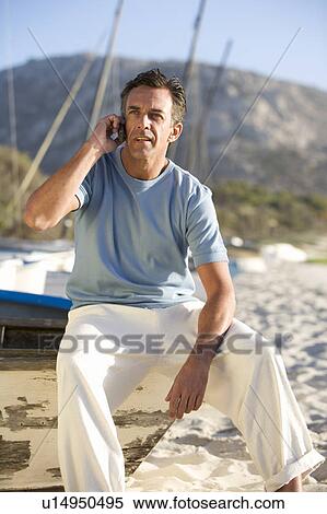 Stock Photography - A man talking on a mobile phone. Fotosearch