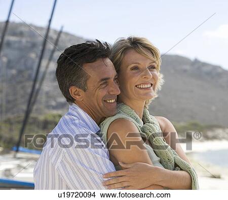 A mature couple on a beach View Large Photo Image Picture - A mature couple on a beach. Fotosearch