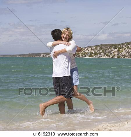 A mature couple on a beach View Large Photo Image Stock Image - A mature couple on a beach. Fotosearch