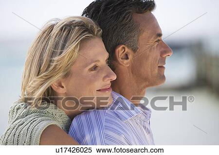 A mature couple on a beach View Large Photo Image Stock Photography - A mature couple on a beach. Fotosearch