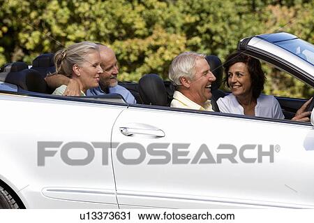 A goup of senior friends in a car View Large Photo Image Stock Image - A goup of senior friends in a car. Fotosearch