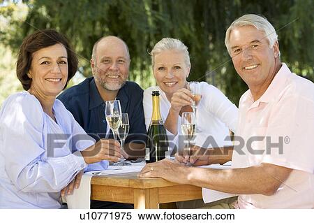 Stock Photography - A group of senior couples celebrating. Fotosearch