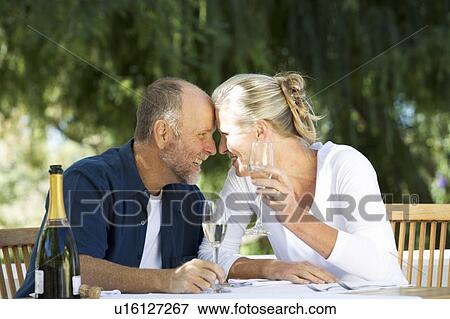 Stock Photo - A senior couple celebrating. Fotosearch